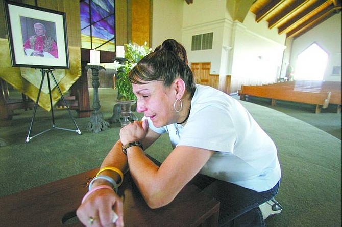 Brad Horn/File Photo Ana Ramirez, 41, of Carson City prays for Pope John Paul II at St. Teresa of Avila Catholic Community.