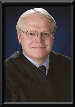 Family Court Judge Chuck Weller, 53, was shot in the chest today while he stood near a window on the third floor of the Mills Lane Justice Center.