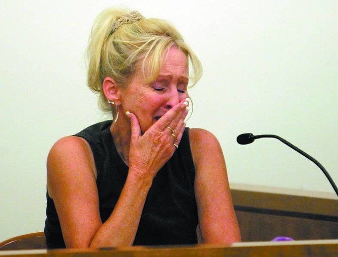 Chad Lundquist/Nevada AppealDonna Wells, above, cries Tuesday in Carson City District Court as she talks of her grief since her son Adam&#039;s murder in October. Her testimony came during the sentencings of the final two men charged in Adam Wells&#039; killing. Danny Shaw, 21, right, received 20 years to life in prison on charges of second-degree murder and kidnapping. Juan Cervantes Jr., 21, left, received a sentence of two years to life in prison on a charge of principal to battery with a deadly weapon.