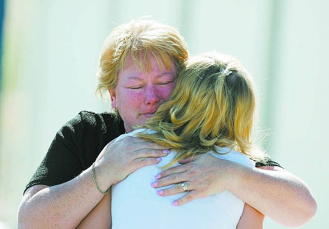 Brad Horn/Nevada AppealTina Glesener hugs her daughter Tiffany Boggs, 16, at Silver Stage High School in Silver Springs on earlier today. The high school was locked down after a hit list with 40 student names and 11 faculty members was found around 9:30 a.m.