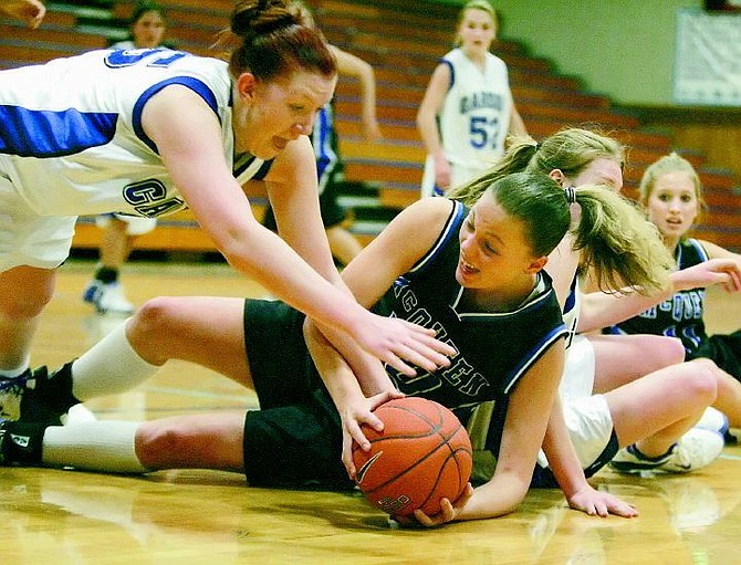 BRAD HORN/Nevada Appeal Carson&#039;s Nicole Scott dives for a loose ball during the Senator&#039;s game against the McQueen Lancers in Carson on Saturday.