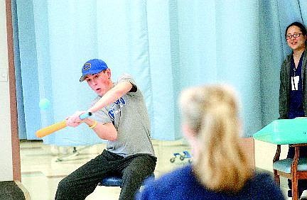 Rick Gunn/Nevada Appeal Jack Maloney drives one home during a game of Nerf baseball in the Carson Rehabilitation  Center in March. During the spring 2005 baseball season, Maloney was diagnosed with the potentially deadly disease called Guillain-Barr&#233; Syndrome that left him paralyzed.