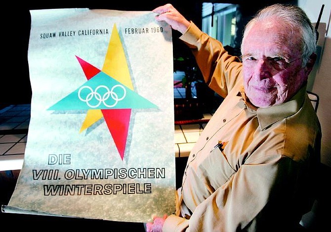 Chad Lundquist/Nevada Appeal Chelton Leonard, 82, holds a poster from the 1960 Olympic Games held at Squaw Valley at his home in west Carson on Monday.