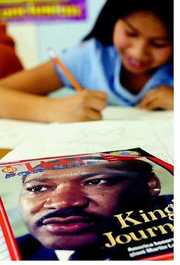 Kevin Clifford/Nevada Appeal A children&#039;s magazine featuring Martin Luther King Jr. was one of many resources fifth-grader Spencer Rose, 10, used during a workshop about the civil-rights leader at Empire Elementary School on Friday.