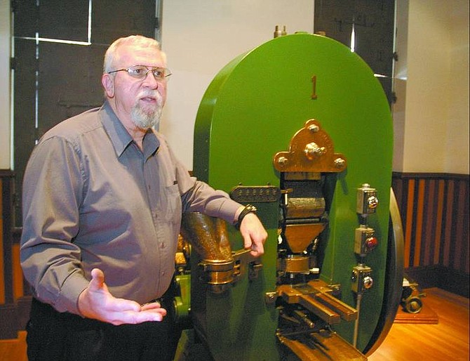 Kevin Clifford/Nevada Appeal Bob Nylen, Curator of the Nevada State Museum explains Friday, Jan. 20, 2006 how Carson City mints medallions using the original 12,000 pound coin press that Carson City received in 1869.