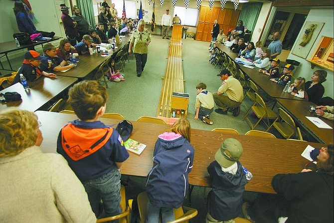BRAD HORN/Nevada Appeal Scouts and their families watch preliminary heats of the Pinewood Derby on Jan. 21.