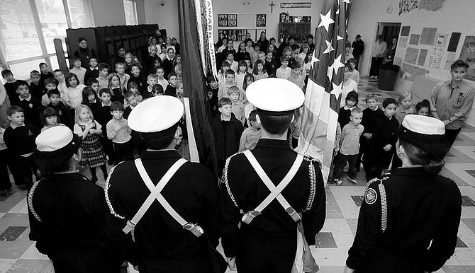 Chad Lundquist/Nevada Appeal Students at St. Teresa of Avila Catholic School celebrate the beginning of the Catholic Schools Week on Monday with a color guard presentation by students from Carson High School Naval Junior ROTC.