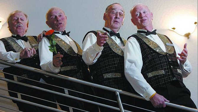 Chad Lundquist/Nevada Appeal Partners in Harmony Barbershop Quartet members, from left, Gil Graham, Bob Wise, Chuck Abercrombie and Tom Hammill, rehearse a number in preparation for the singing valentines they will deliver on St. Valentine&#039;s Day.