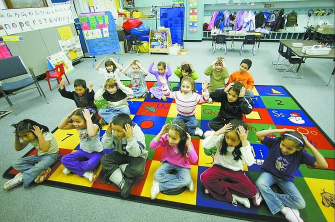 BRAD HORN/Nevada Appeal Joanne Green&#039;s kindergarten class at Empire Elementary School learns the months and days of the week during an afternoon session Wednesday. Empire&#039;s kindergarten class of 2006-07 will be the first to attend all-day classes as required by a federal education act.