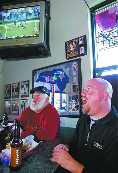 Chad Lundquist/Nevada Appeal Don Sportsman and Dave Richardson, both of Gardnerville, react to a play during the first half of Superbowl XL on Sunday at Bully&#039;s Sports Bar.