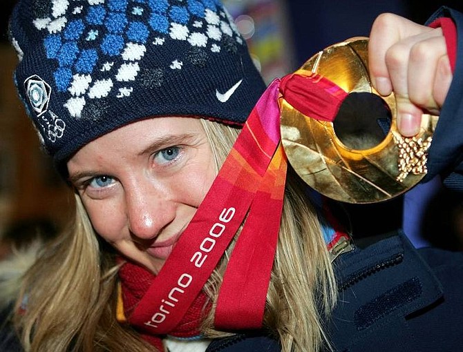 United States snowboarder  Hannah Teter poses with her gold medal after the medal  ceremony for the Women&#039;s Halfpipe Snowboard event at the Turin 2006 Winter Olympic Games in Turin, Italy on Monday.   Greg Baker Associated Press