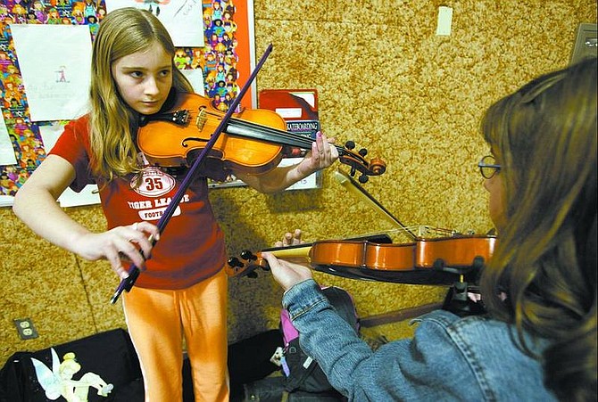 Cathleen Allison/Nevada Appeal Seeliger Elementary School students Madyson Stokes, 11, and Melissa Rhees, 10, rehearse Wednesday at the school for tonight&#039;s variety show.