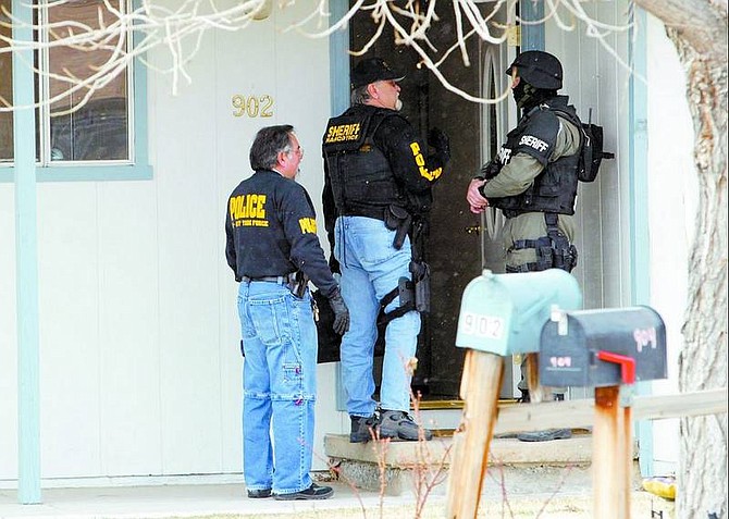 Douglas County Sheriff&#039;s deputies, TRI-NET officers and SWAT team members searched a home at 902 Peridot Court in Indian Hills on Friday. One person was arrested at the home and four others were arrested at nearby home improvement center.   Shannon Litz/Nevada Appeal News Service