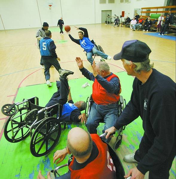 Inmates in the Senior Structured Living Program play wheelchair basketball once a week.