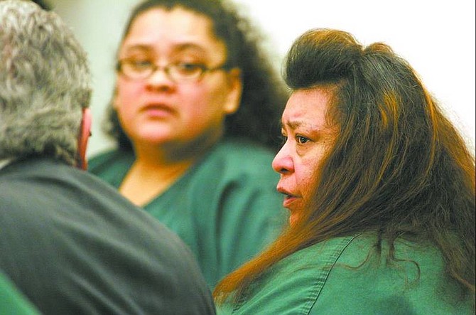 Cathleen Allison/Nevada Appeal Esther Rios talks with her lawyer during a preliminary hearing Friday. Rios, her daughter Regina Rios, at rear, and her daughter&#039;s husband, Tomas Granados, have all been charged with felony child abuse, child neglect and false imprisonment for allegedly locking Regina Rios&#039; 16-year-old daughter and 11-year-old son in the bathroom and starving them for several years.
