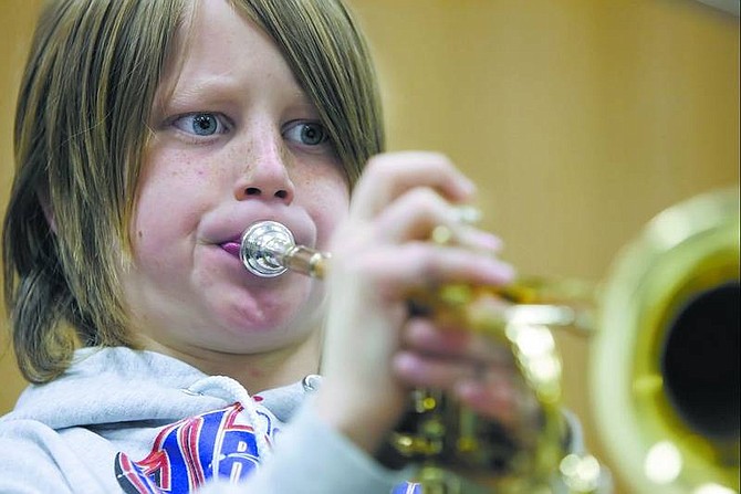 Chad Lundquist/Nevada Appeal Fremont Elementary School student Willy McDonald, 11, practices for Band-o-rama in teacher Sandra Irvin&#039;s class on Tuesday.