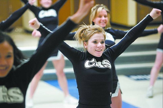 Cathleen Allison/Nevada Appeal Brittaney Gordon, 16, and the Carson High School cheerleading squad practice Wednesday for the first-ever statewide cheer championships. Fifty teams will compete Saturday at the high school.