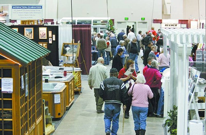 Consumers browse through the exhibits at the 10th annual Reno Total Home Show Friday afternoon at the Reno Sparks Convention  Center.  Cathleen Allison/ Nevada Appeal