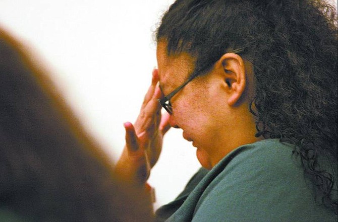 Cathleen Allison/Nevada Appeal Regina Rios cries during her preliminary hearing Friday as a pediatrician testifies about the impact malnutrition had on two of Rios&#039; children. Rios, her husband, Tomas Granados, and her mother, Esther Rios, face felony child abuse charges for allegedly locking Rios&#039; 16-year-old daughter and her 11-year-old son in a bathroom and starving them for years.