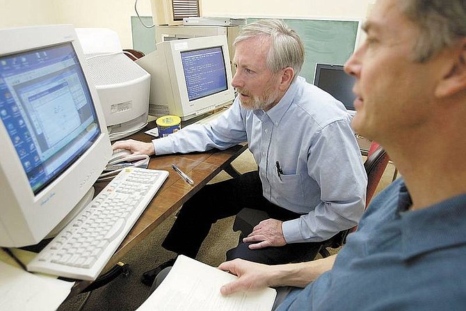 Patrick Mulreaney and Paul Murphy work on the multimedia Internet Irish dictionary that are building March 9, 2006, at their office in Minden, Nev. (AP Photo/The Record-Courier, Shannon Litz)