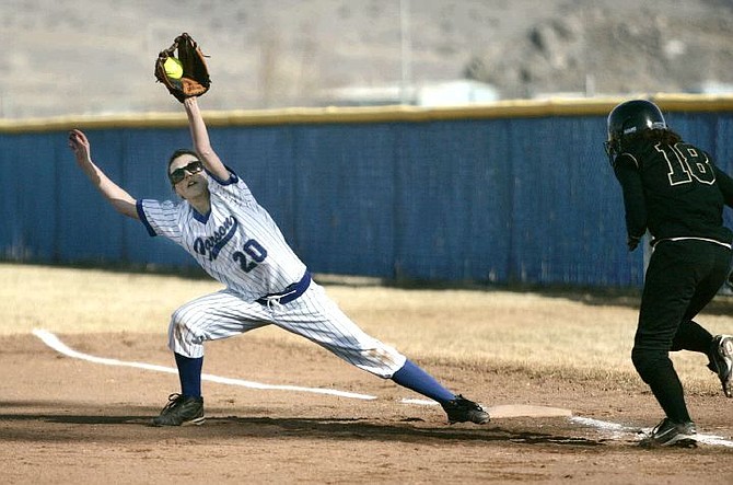 Cathleen Allison/Nevada Appeal Carson first baseman Jessica Leonard gets Galena&#039;s Kellie McGinley out in the first inning of Tuesday&#039;s game at CHS.