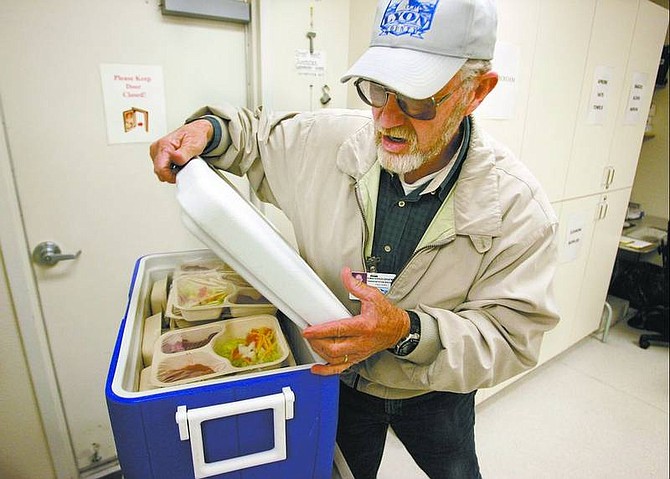Cathleen Allison/Nevada Appeal Fred Dory prepares to deliver Meals on Wheels on Wednesday morning at the Dayton Senior Center. The center is participating in the nationwide movement, March for Meals, to raise money for the program.