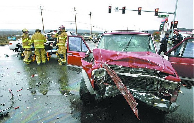 Cathleen Allison/Nevada Appeal Firefighters transported two people to Carson Tahoe Regional Medical Center on Tuesday afternoon after an accident at Graves Lane and Highway 50 East.