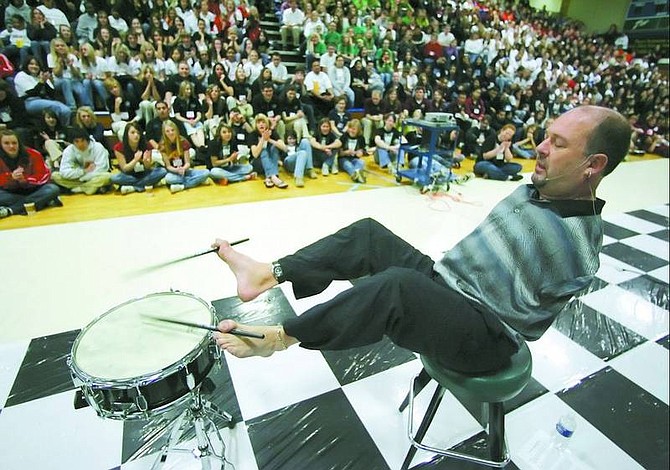 BRAD HORN/Nevada Appeal Motivational speaker Alvin Law plays a snare drum at Carson High School on Friday morning. Law, who has spoken to more than one million students, was born without arms, but doesn&#039;t let it get in the way of his dreams.