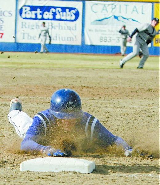 BRAD HORN/Nevada Appeal Carson&#039;s Sean Costella dives safely into third base after hitting a triple and driving in the go ahead run in the sixth inning in the Senator&#039;s game against Damonte Ranch at Ron McNutt Field on Saturday. Costella scored on the play on an error.