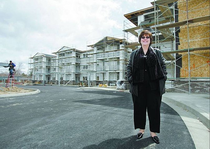 Chad Lundquist/Nevada Appeal Janice McIntosh, director of Carson City Senior Citizens Center, stands outside the Autumn Village affordable housing complex Wednesday.