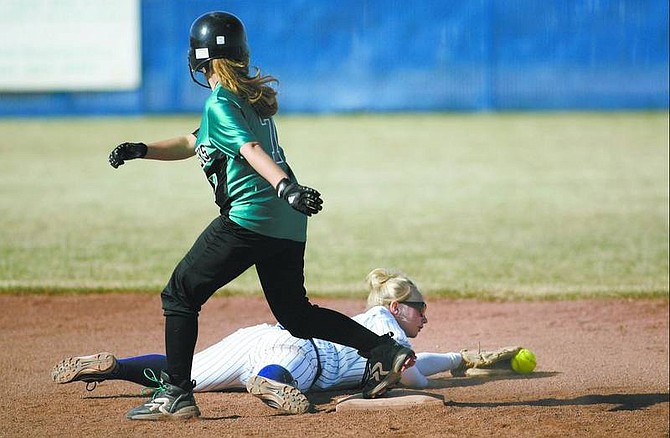 Cathleen Allison/Nevada Appeal  Carson&#039;s Dezzy Clampitt lays out trying to make the play on against North Valley&#039;s Jessica Kleinschmidt in the fourth inning of Thursday&#039;s game at CHS. Carson won 11-1.