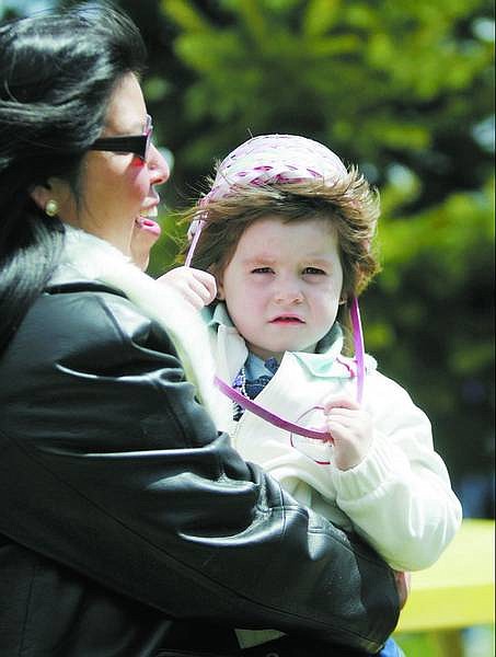 BRAD HORN/Nevada Appeal Donna Brooks holds Jade Littrell, 2, of Reno, before the Easter egg hunt in Virginia City on Saturday.