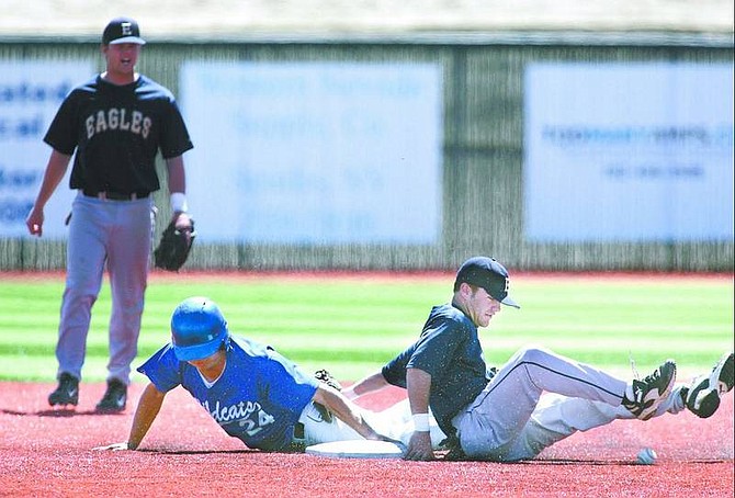 Cathleen Allison/Nevada Appeal Wildcat&#039;s Aaron Henry steals safely to second base against Eastern Utah&#039;s Colston Robinson in the first game of a double-header at WNCC on Friday.
