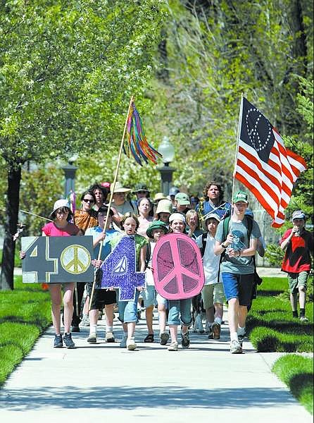 Chad Lundquist/Nevada Appeal Marchers approach the Capitol Sunday afternoon, signaling the end of their two-day journey to promote peace. The marchers carried more than 200 origami cranes with them as a symbol of peace.