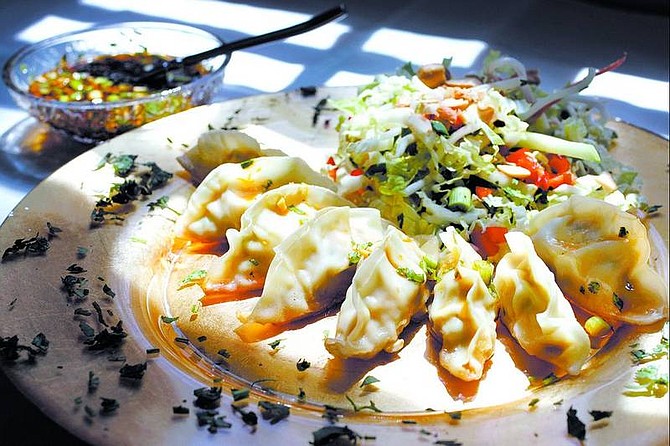 Chad Lundquist/Nevada Appeal Martin Yan&#039;s Potstickers with Mandarin Pork Filling and Hot and Sour Chili Sauce, as prepared by Molly Gingell.