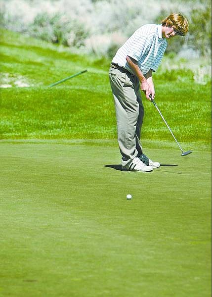 Cathleen Allison/Nevada Appeal  Carson&#039;s Jimmy Potter putts on the fourth hole at Montana at Genoa Lakes Golf Course on Tuesday afternoon.
