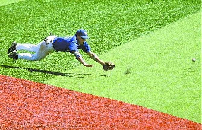 BRAD HORN/Nevada Appeal Western Nevada Community College second baseman Kyle Bondurant dives for a ball during their game on Friday.