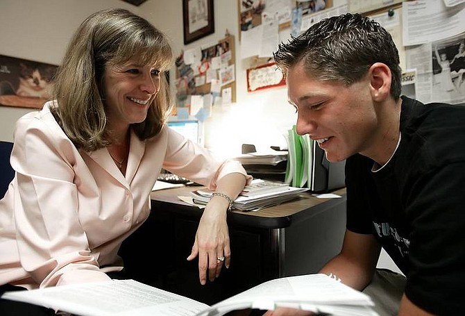 Chad Lundquist/Nevada Appeal Counselor Cherie Gavuzzi talks with Carson High student Dex Espinoza, 17, in her office on Tuesday afternoon. Gavuzzi is one of three recipients in the Carson City School District that will receive the esteemed Ormsby County Education Association awards.