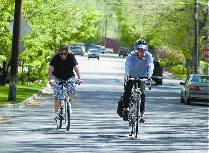 Kevin Clifford/Nevada Appeal Rota Rosaschi, left, and Barbara Howe ride up a slight slope on South Nevada Street on Friday afternoon. Rosasschi and Howe are trying to raise awareness on obesity and this week&#039;s Bike to Work Week.