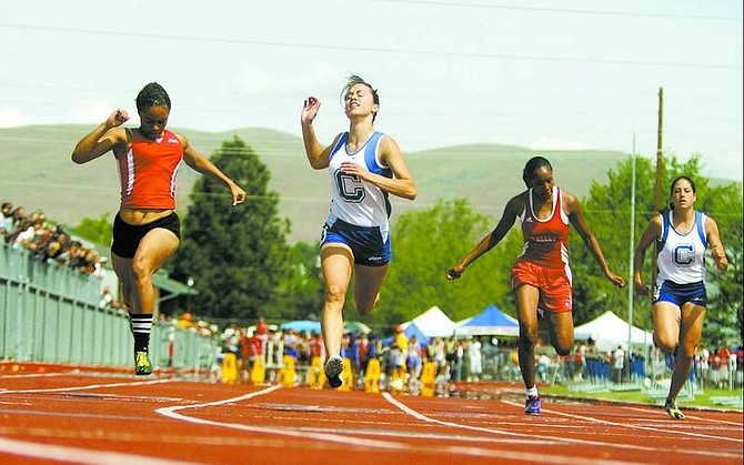 BRAD HORN/Nevada Appeal Carson&#039;s Kayla Sanchez crosses the finish line during the 100 meter finals at the NIAA 4A State Championships on Saturday at Reno High School. Sanchez claimed three state titles.
