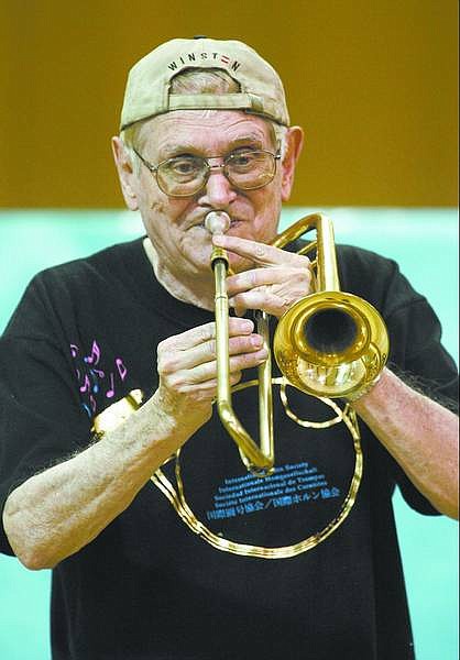 Cathleen Allison/Nevada Appeal   Dan Ballard performs for a group of Seeliger Elementary students Wednesday afternoon. Ballard, a retired teacher, brought the &quot;10,000 Years of Horns&quot; program to the school.