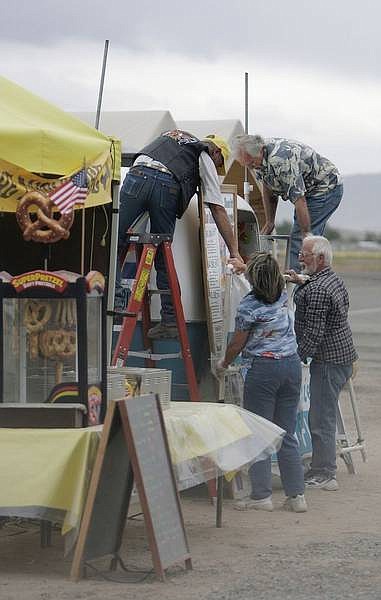 Chad Lundquist/Nevada Appeal  Strong winds and sporadic rain showers caused vendors to pack-up early at Sunday&#039;s Lyon County Fly-in in Silver Springs.