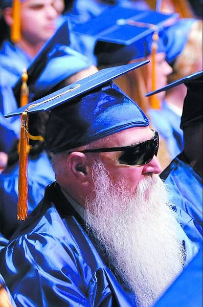 Chad Lundquist/Nevada Appeal  Paul Spears, 60, sits with fellow graduates during Tuesday night&#039;s Western Nevada Community College commencement ceremony at the Carson City Community Center. Spears, who is blind due to diabetes, graduated with an associate of arts degree and hopes to work toward a bachelor&#039;s in education.