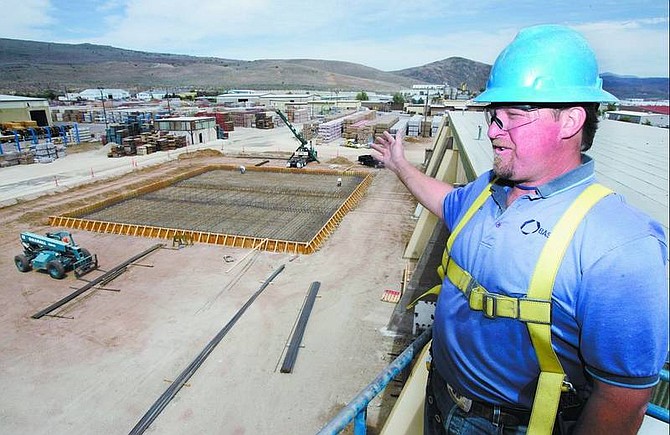 Chad Lundquist/Nevada Appeal Michael Fitzgerald, 42, a production supervisor for Basalite in Carson City talks about one of the new areas under-construction Wednesday. The Concrete manufacturer plans to add 14 jobs in a $14 million expansion expected to be completed this year.