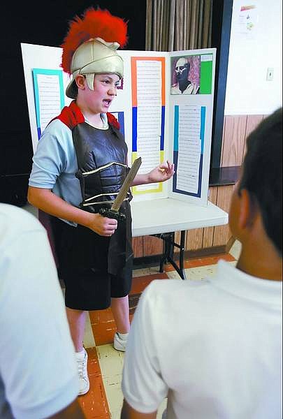 Chad Lundquist/Nevada Appeal Seventh-grader Jonathan Loomis, 13, donned Roman garb to take on the role of Julius Caesar for a presentation on Italy Wednesday afternoon at St.  Teresa of Avila School.
