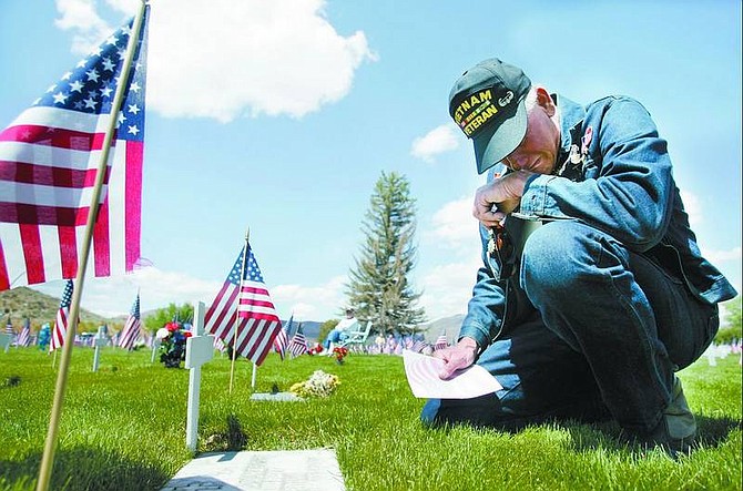 Chad Lundquist/Nevada Appeal Overcome with tears, Vietnam veteran Steve Jazercak, 59, takes a moment to mourn at the grave of a friend&#039;s father. The man died in the Tet offensive in Vietnam, said Jazercak just after the Memorial Day Service at Lone Mountain Cemetery on Monday. &quot;I went to Vietnam with 10 of my friends and ended up burying eight of them&quot; - one of whom was his high school friend.