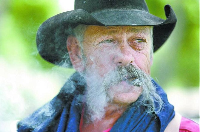 Cathleen Allison/Nevada Appeal  Stagecoach operator Gary Teel talks about the Rendezvous at Mills Park this weekend. The free event includes a mountain man encampment, gunfighters, a Dutch oven cook-off and entertainment.