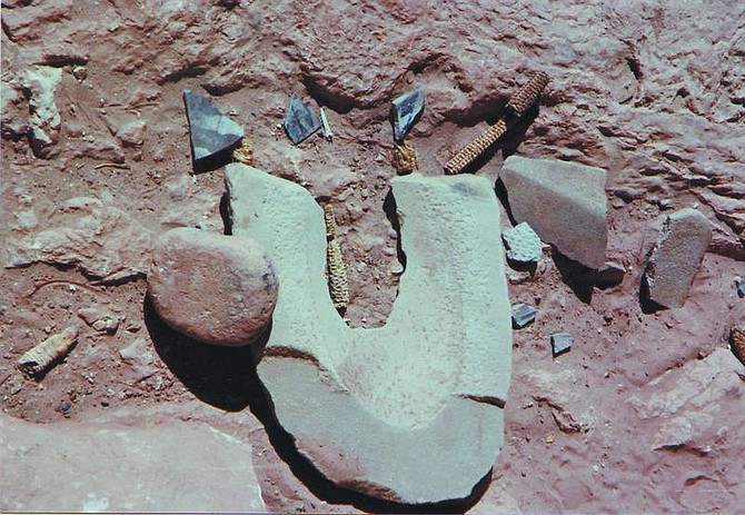 PAT DEVEREUX/NEVADA APPEAL A metate, corncobs and pottery shards lie unmolested at an Anasazi site in Grand Gulch in Utah. Put an artifact in your pocket, and you are committing a felony offense, under the Archaeological Resources Protection Act.