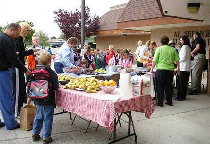 Arlene Richartz/Special to the Appeal Students snack on healthy foods like bananas, pears and oranges after walking or biking to Seeliger Elementary School May 23 for Walk &#039;n Roll to School Day.