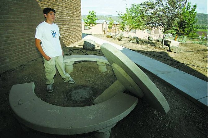 BRAD HORN/Nevada Appeal Michael Montiel, a 16-year-old sophomore at Carson High School, is restoring the memorial garden at Eagle Valley Middle School for his Eagle Scout project. The garden was established in honor of former teacher Wally Keller, and Montiel plans to add science teacher Eric Anderson, who died in 2004.
